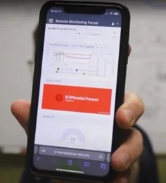 Image of a mobile phone display showing SMART Plant remote monitoring software